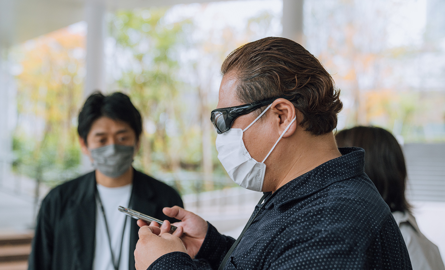 The lead user is interacting with the smartphone