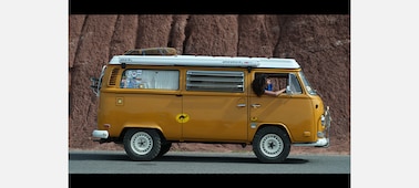 Example image of a campervan driving along the road