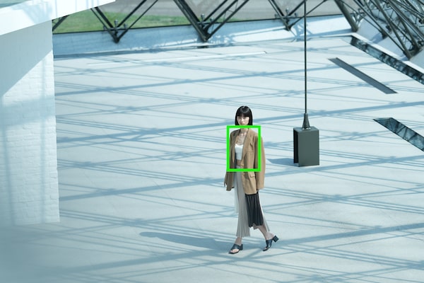 Image of a woman walking in an open space